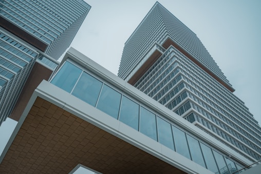 a very tall building sitting next to a very tall building