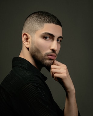 photography poses for men,how to photograph instagram ax.behrooz; a man with a shaved head and a black shirt