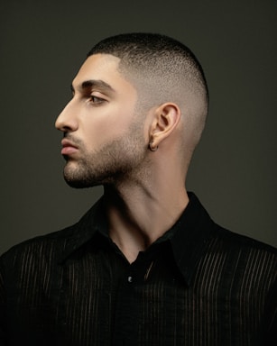 photography poses for men,how to photograph instagram ax.behrooz; a man with a shaved head and a black shirt