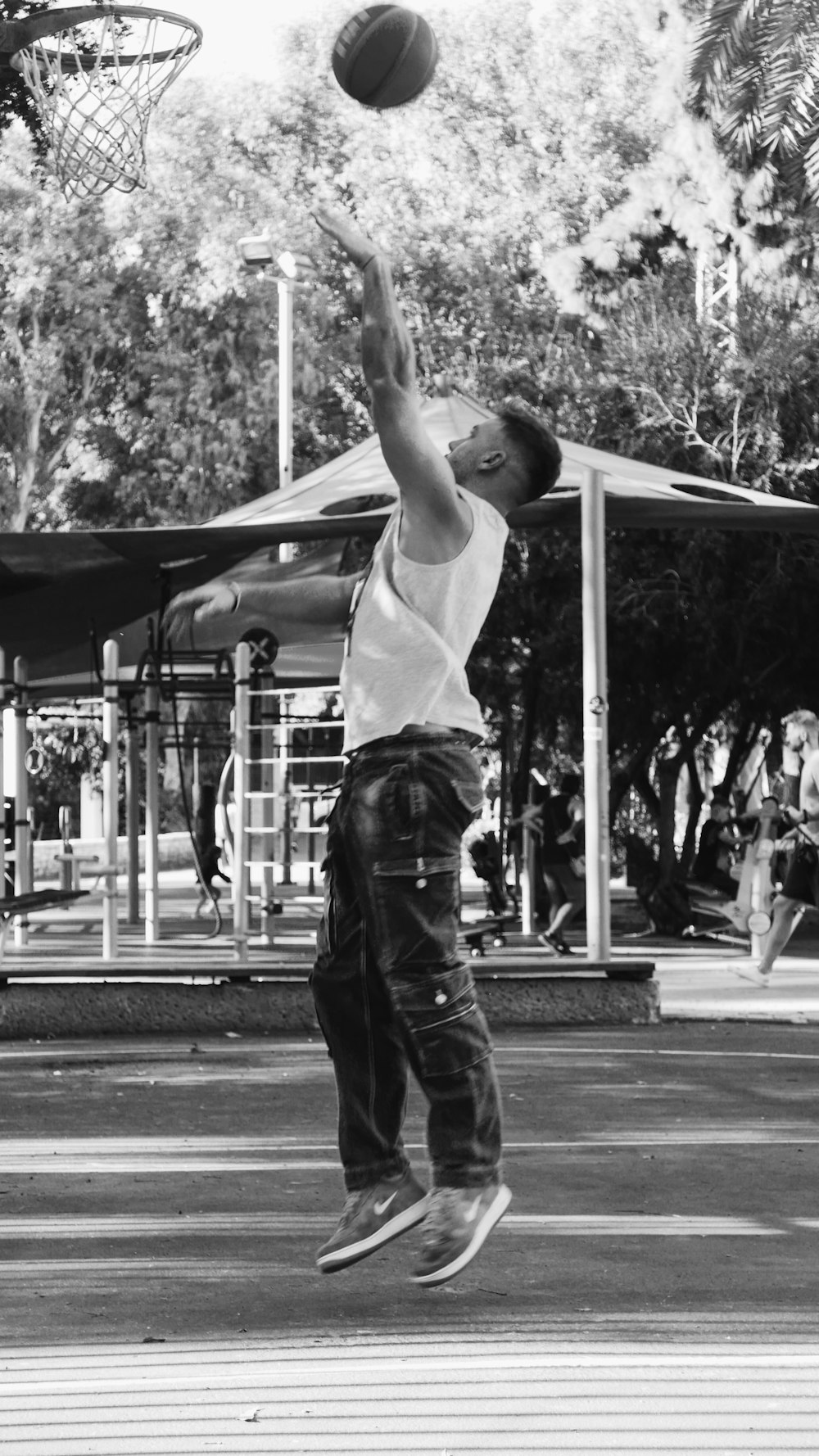 a man is jumping in the air to catch a basketball