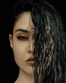 a close up of a woman with wet hair