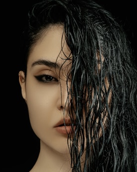 a close up of a woman with wet hair