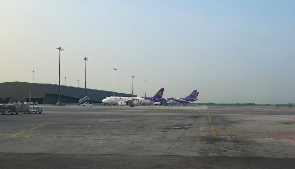 a couple of planes that are on a runway