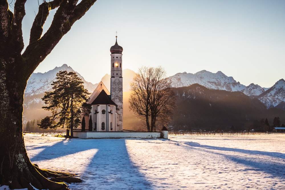 a church in the middle of a snowy field