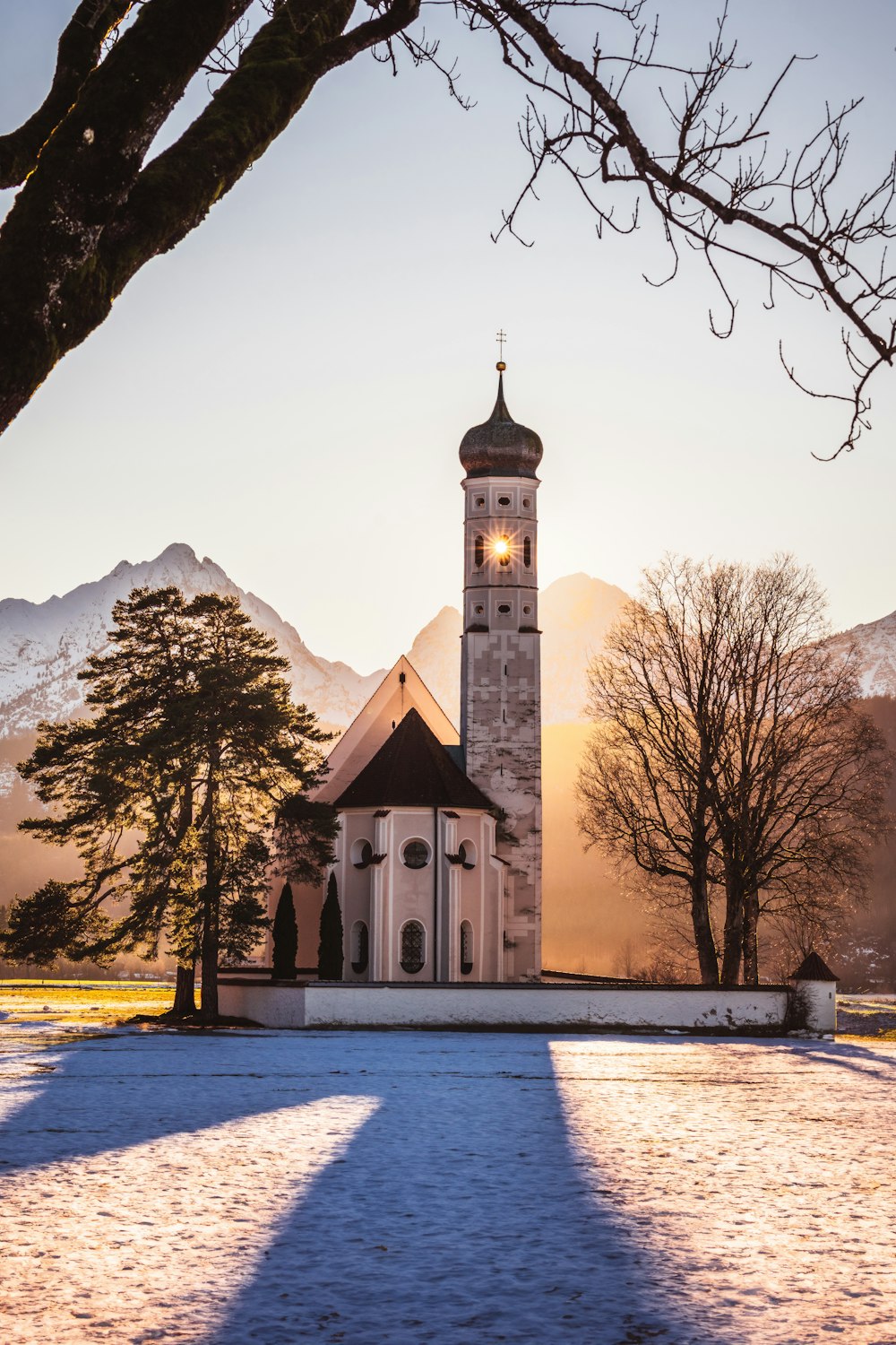 a church in the middle of a snowy field