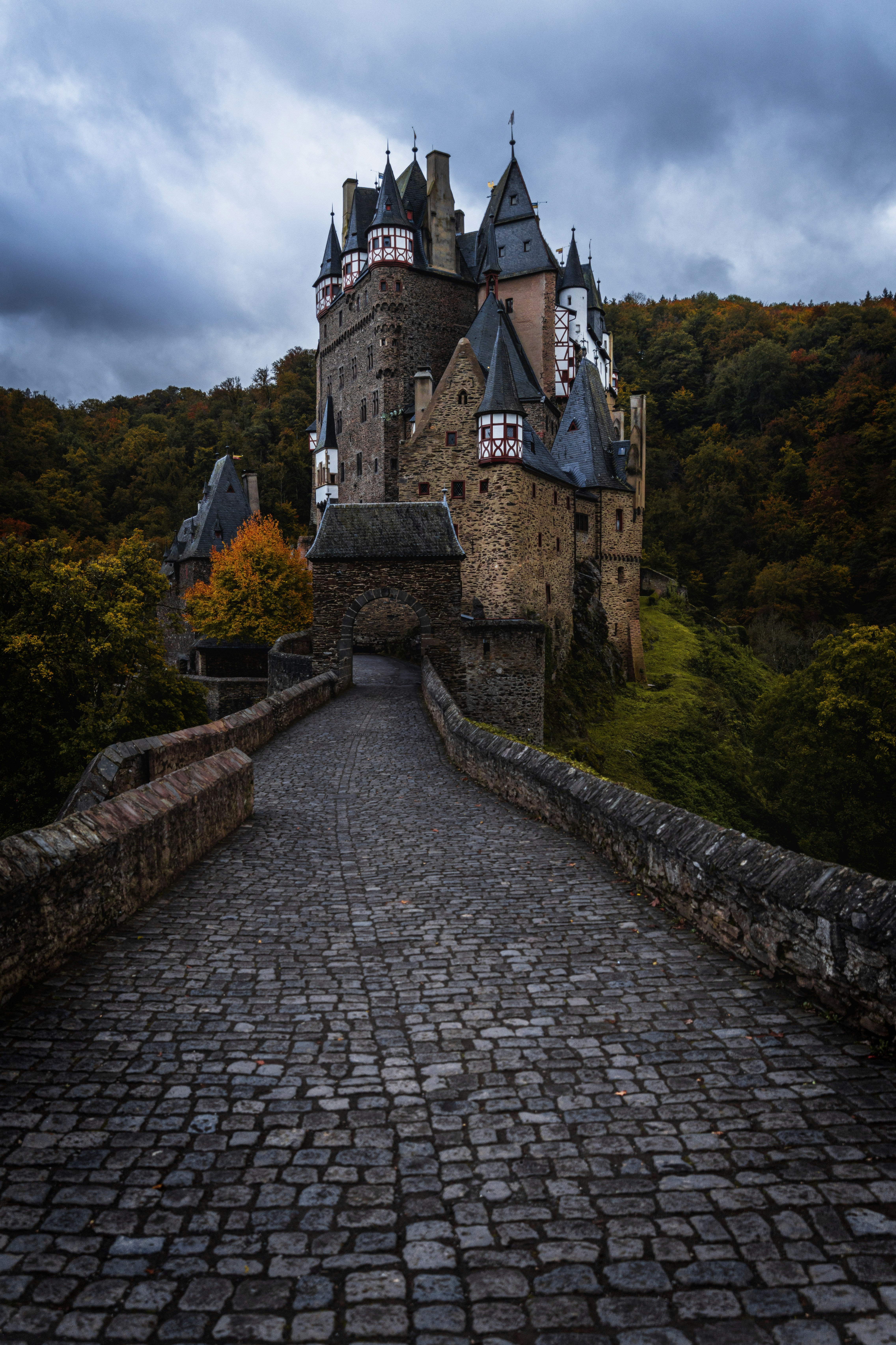 a large castle sitting on top of a stone bridge