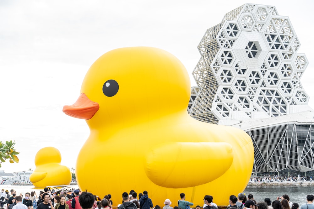 a large yellow rubber duck floating in the water