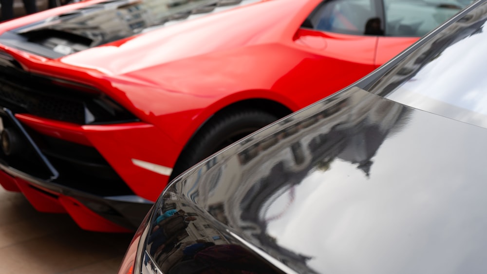 a close up of the front of a red sports car