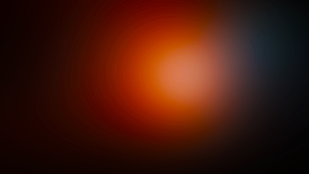 a blurry image of a red and black background