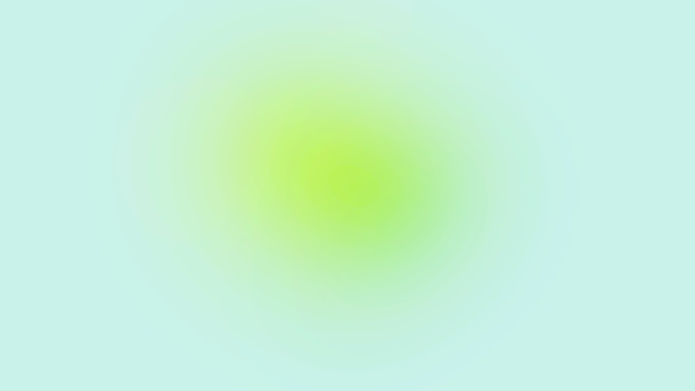 a blurry image of a green circle on a blue background