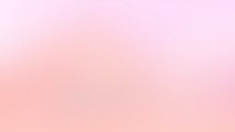 a blurry image of a pink and white background