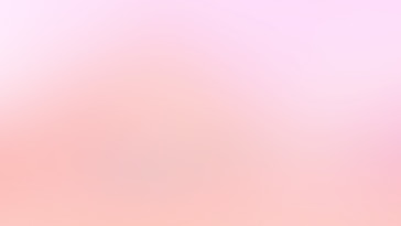 a blurry image of a pink and white background