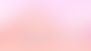 a blurry image of a pink and white background