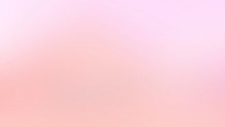 a blurry image of a pink and white background