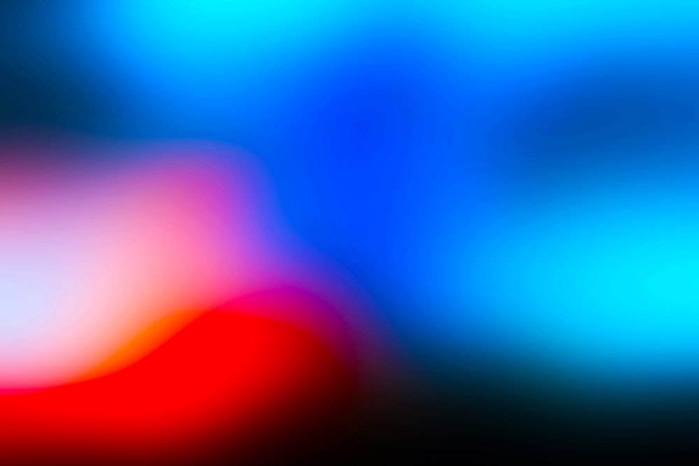 a blurry image of a red and blue background