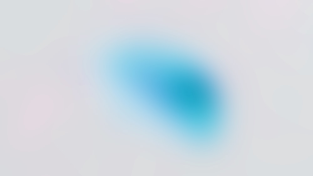 a blurry image of a blue circle on a white background