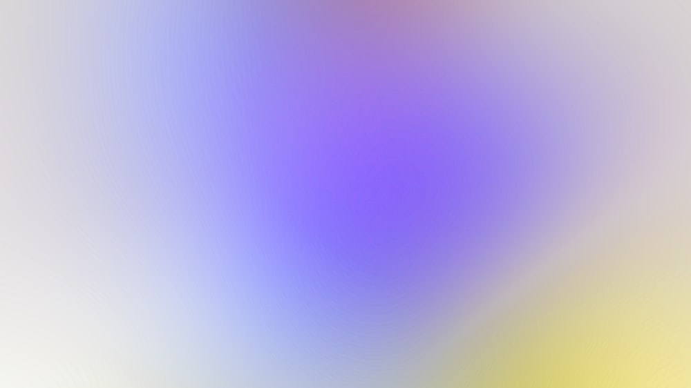 una imagen borrosa de un fondo amarillo y morado