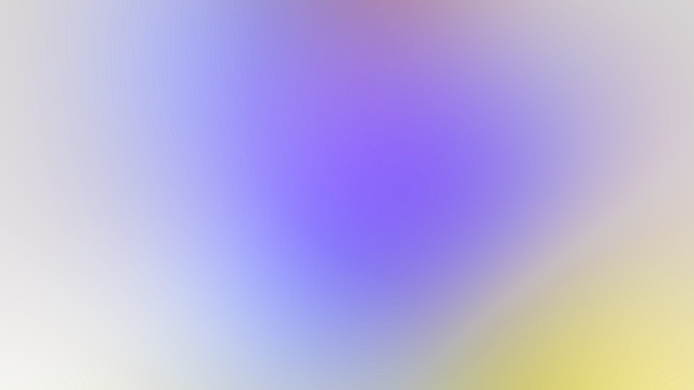 a blurry image of a yellow and purple background