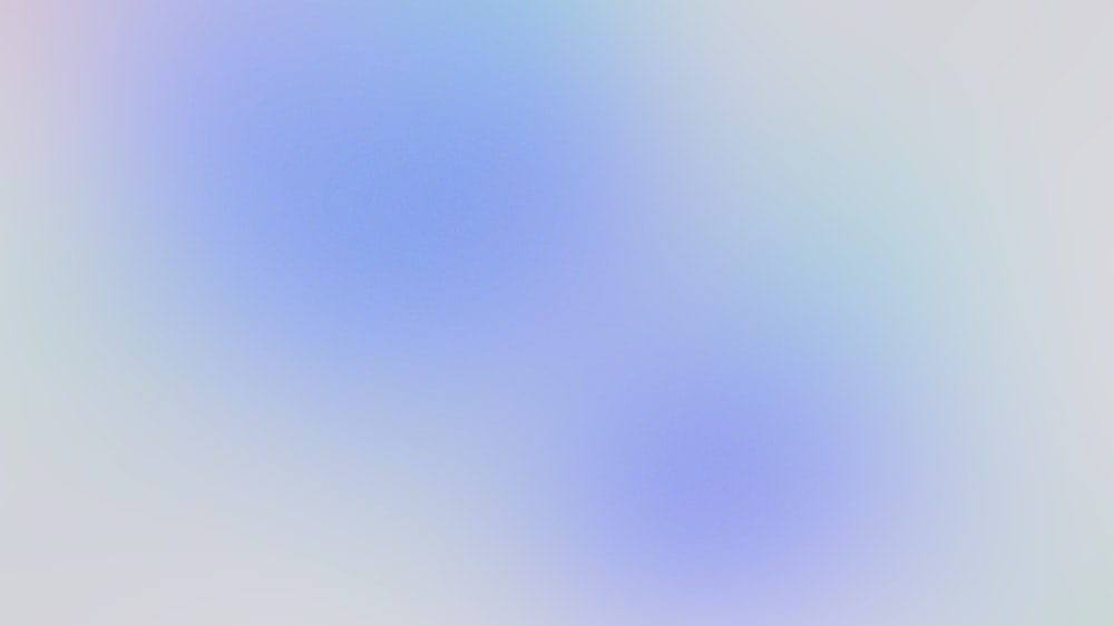 a blurry image of a blue and white background