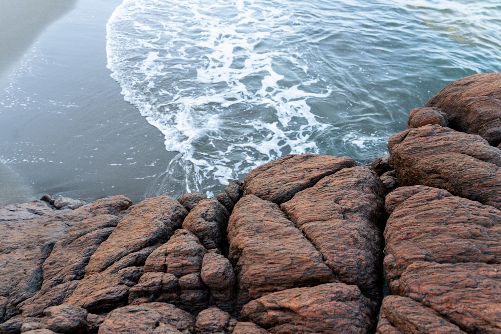 a view of the ocean from a rocky shore