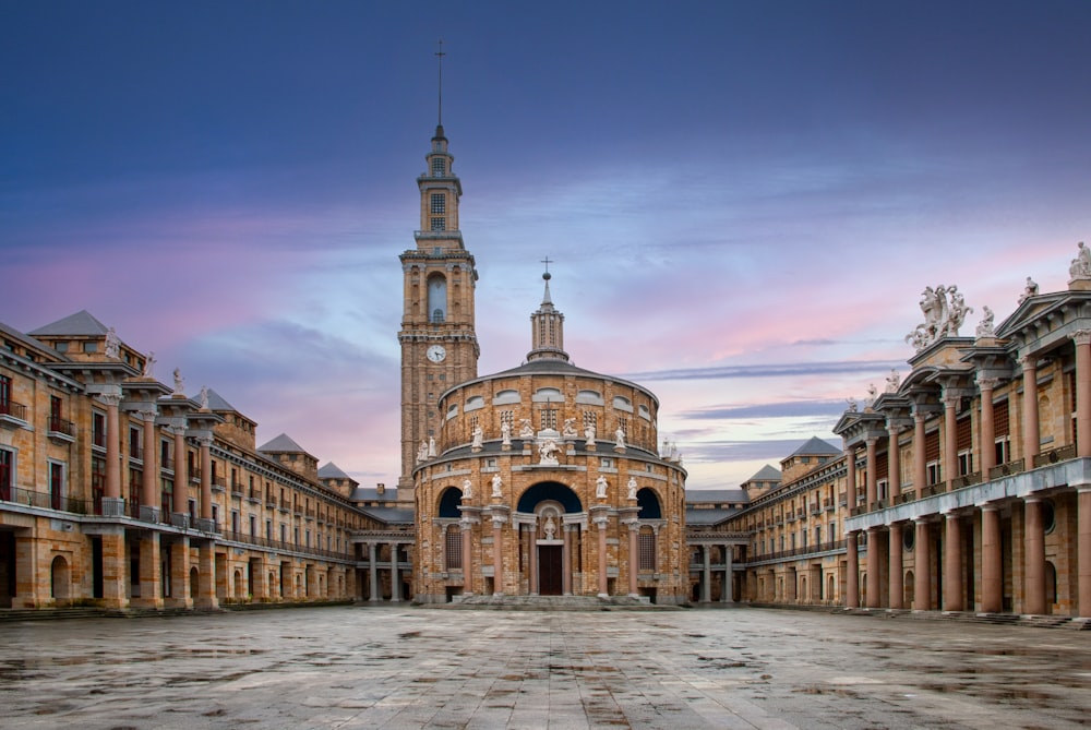 a large building with a clock tower in the middle of it