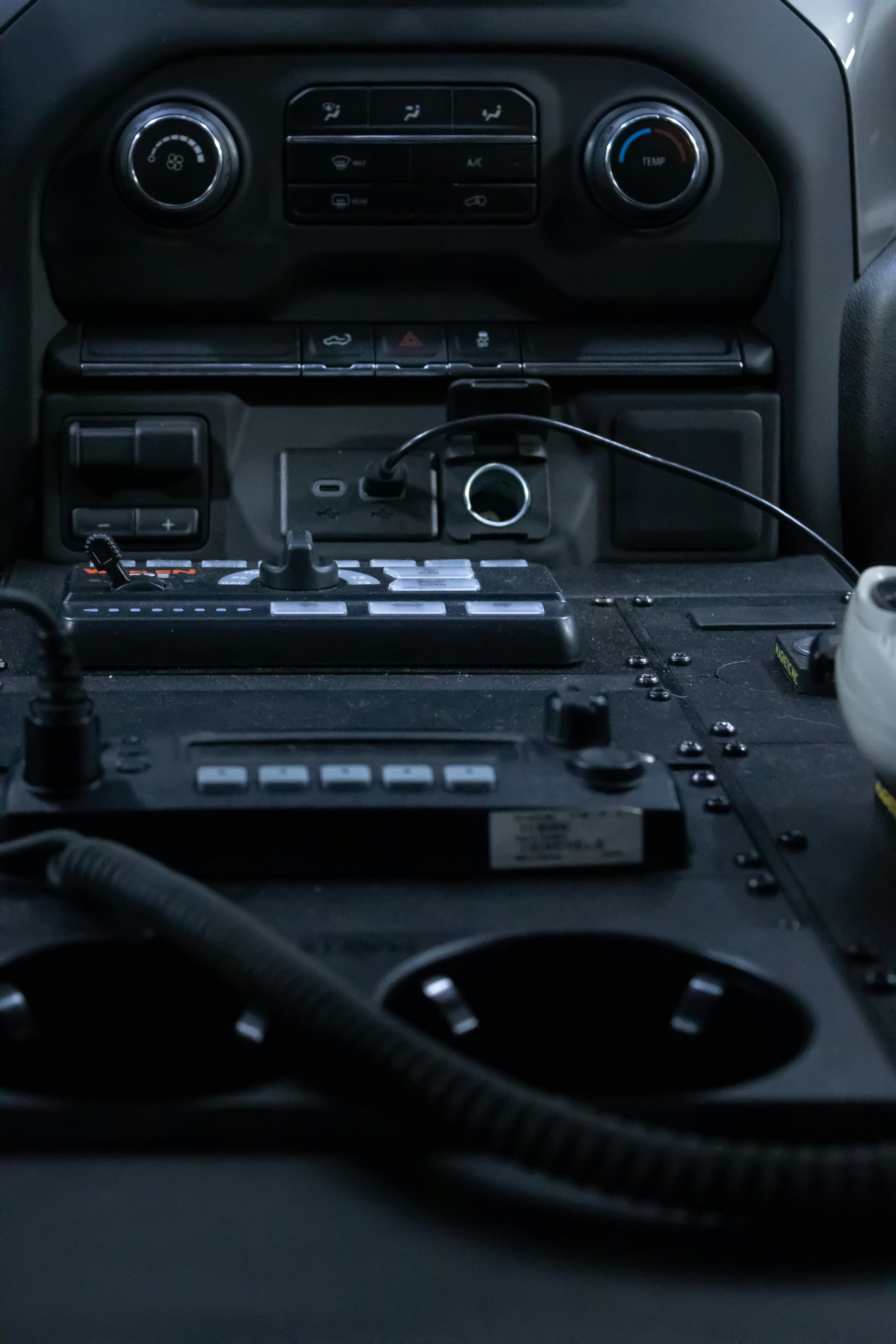 a car dashboard with a radio and other electronics