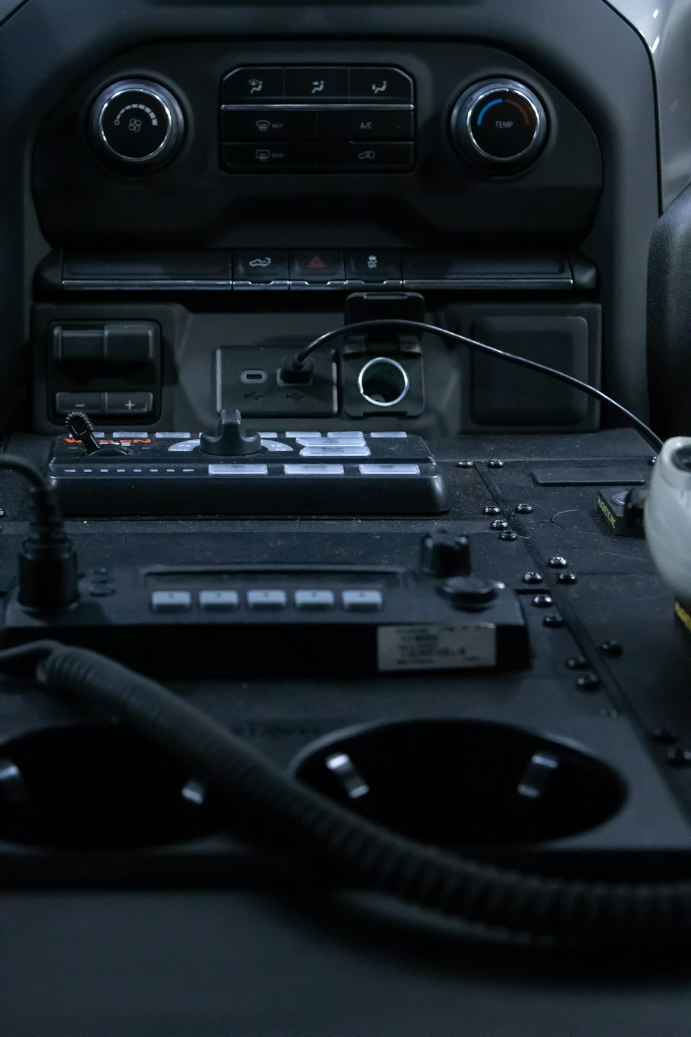 a car dashboard with a radio and other electronics