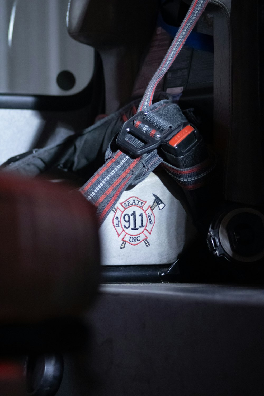 a fireman's helmet and fire hose in the back of a fire truck