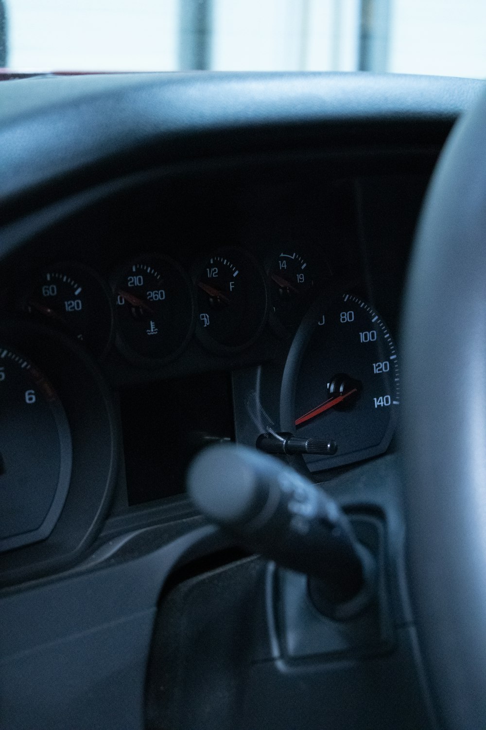 a car dashboard with a speedometer and gauges