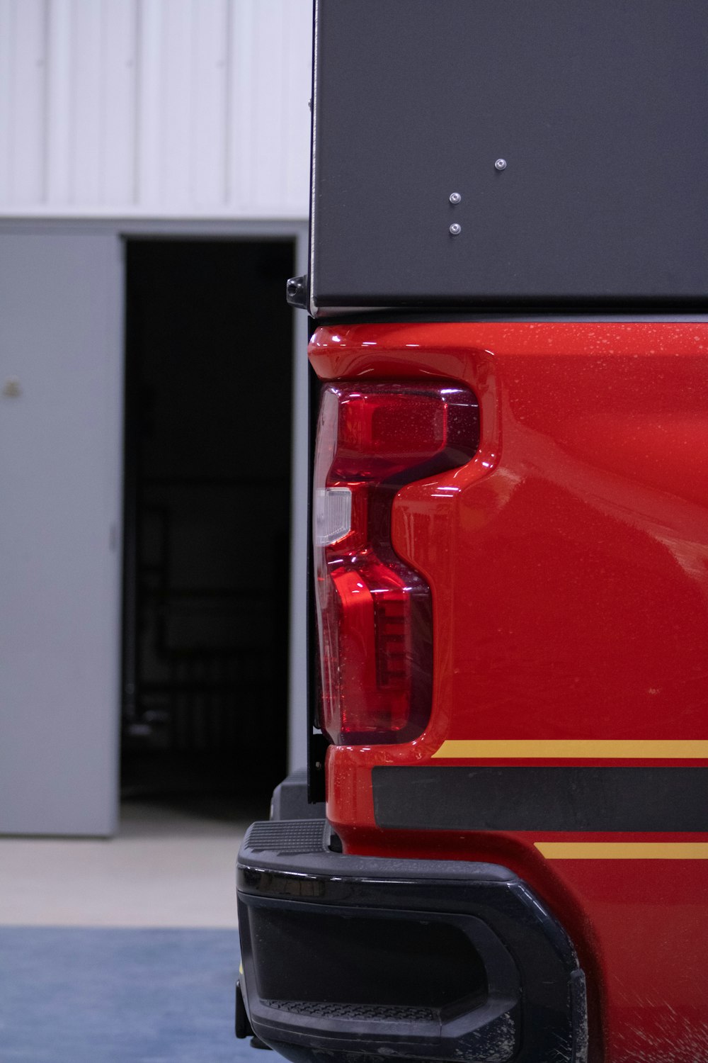 a close up of the tail lights of a red truck