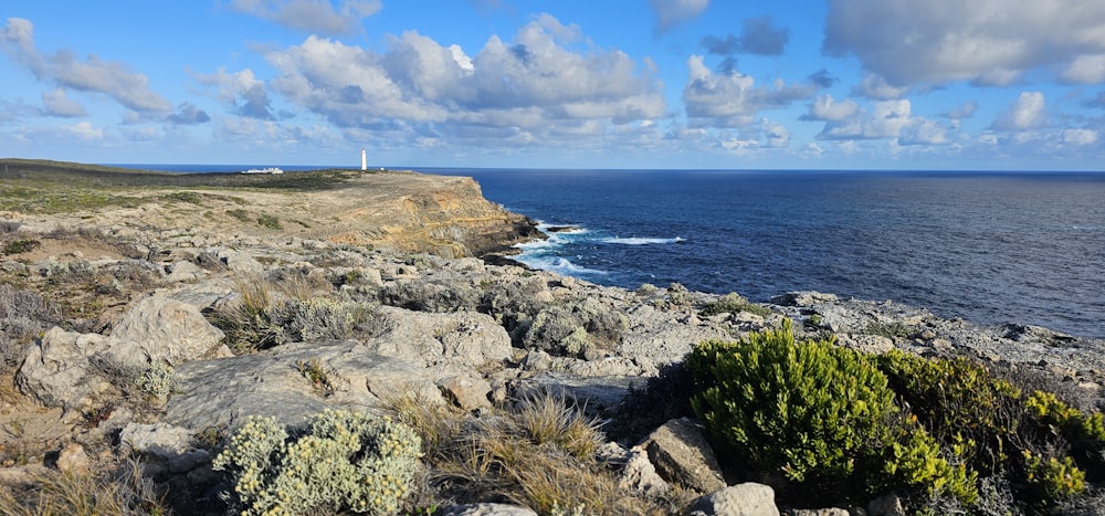 a view of the ocean from a rocky cliff