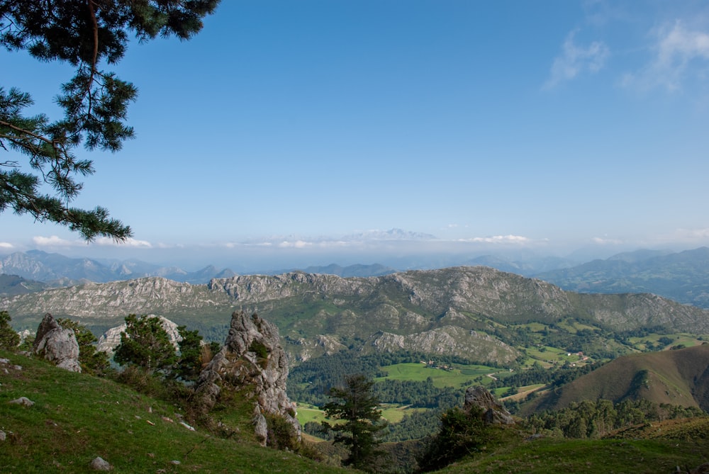 a view of a mountain range from a hill