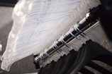 a close up of a metal object with plastic covering