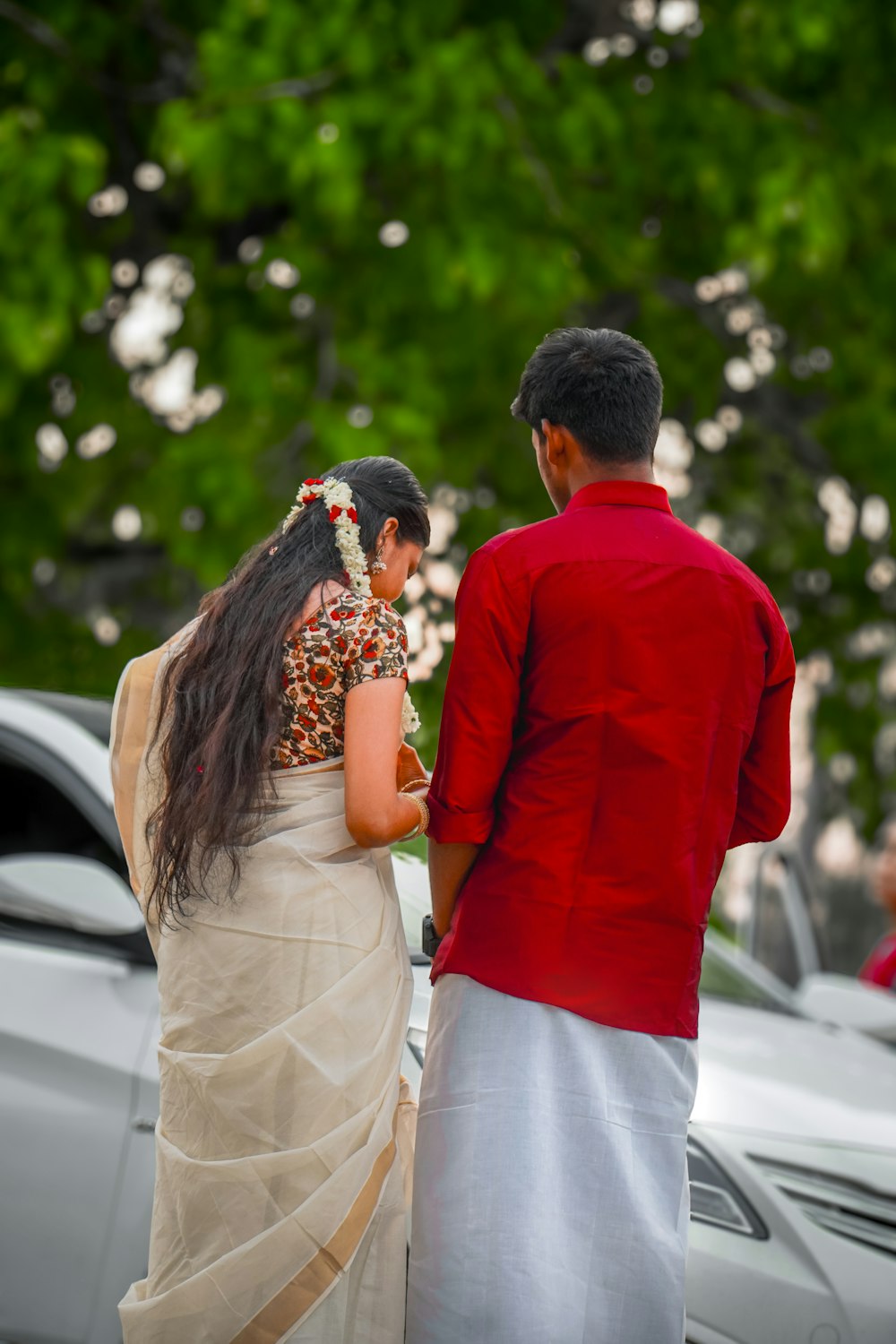 a man and a woman standing next to each other