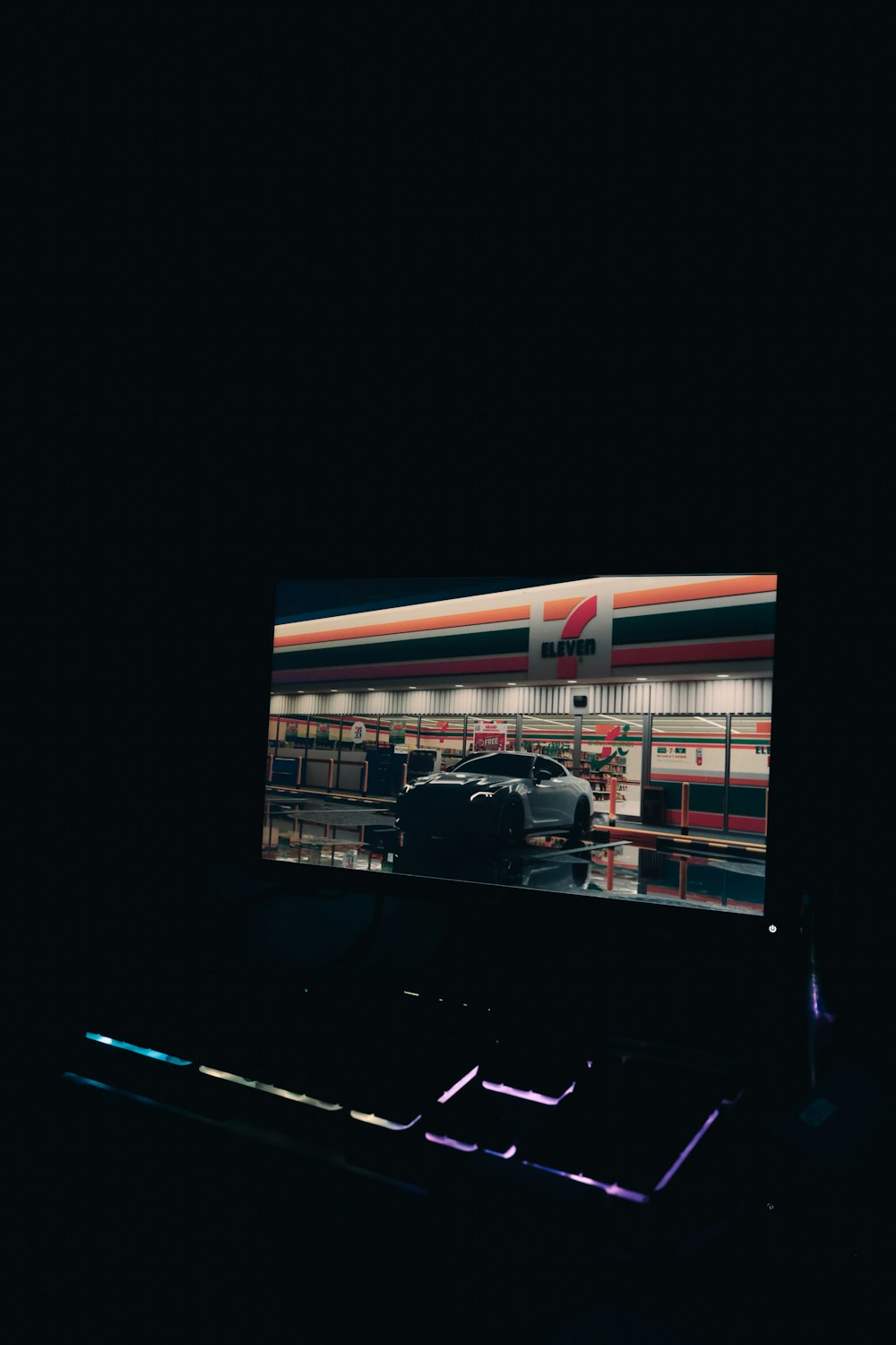 a car is shown on a screen in the dark
