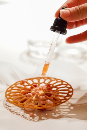 a person holding a syring in their hand