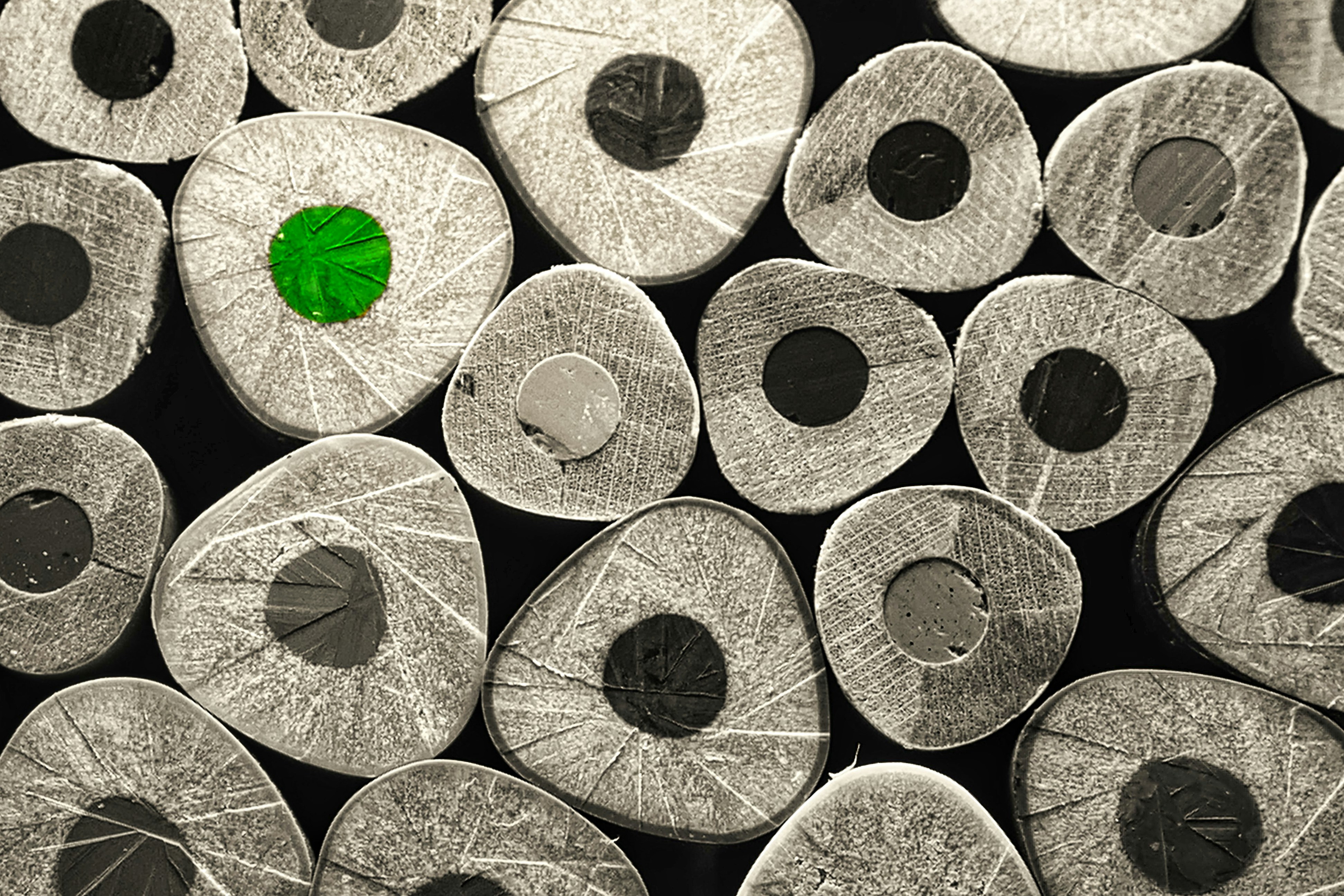 AI battery materials research - a group of metal pieces with a green piece in the middle of them
