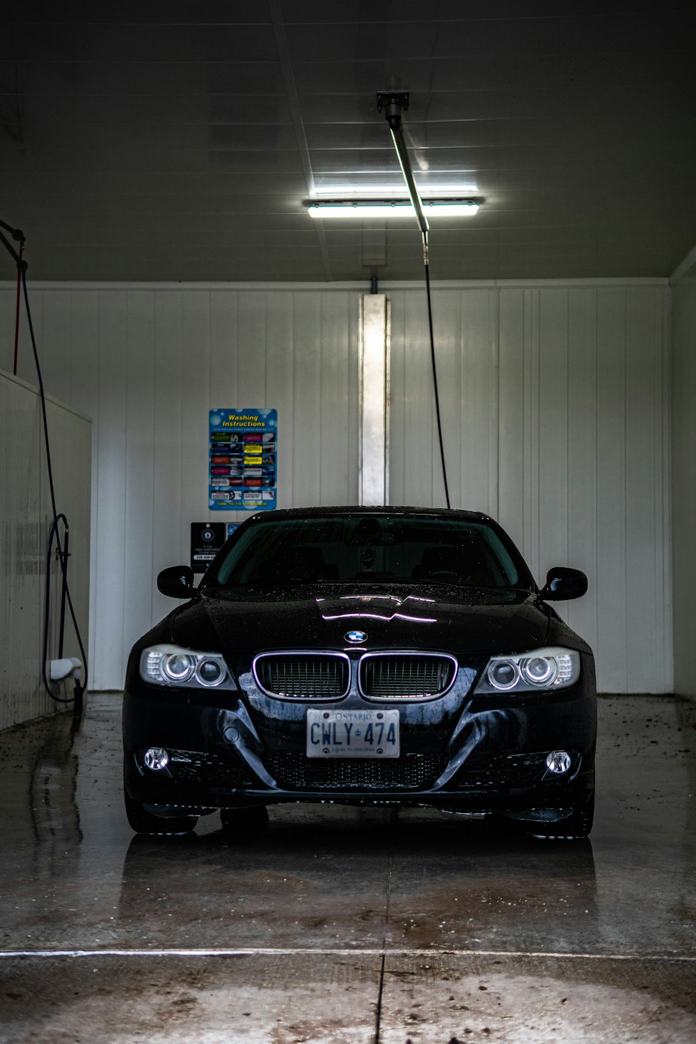 a black car is parked in a garage