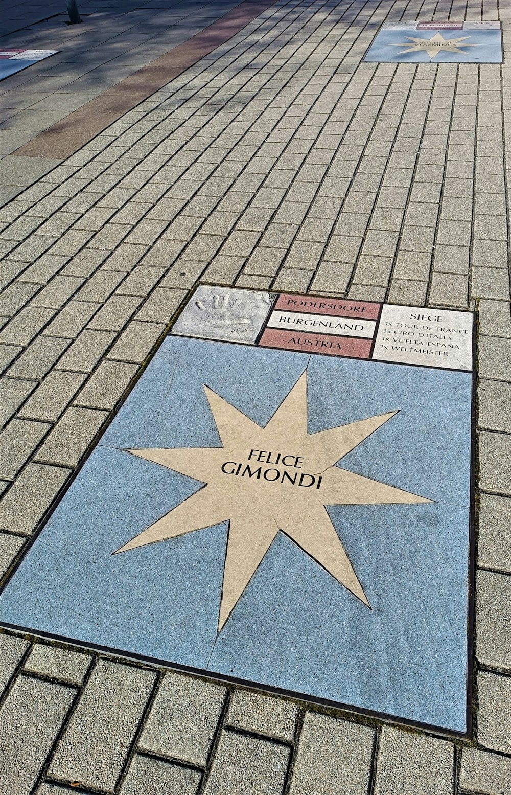 a star is on the ground in front of a building