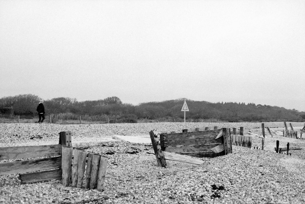 a black and white photo of a boat on a beach