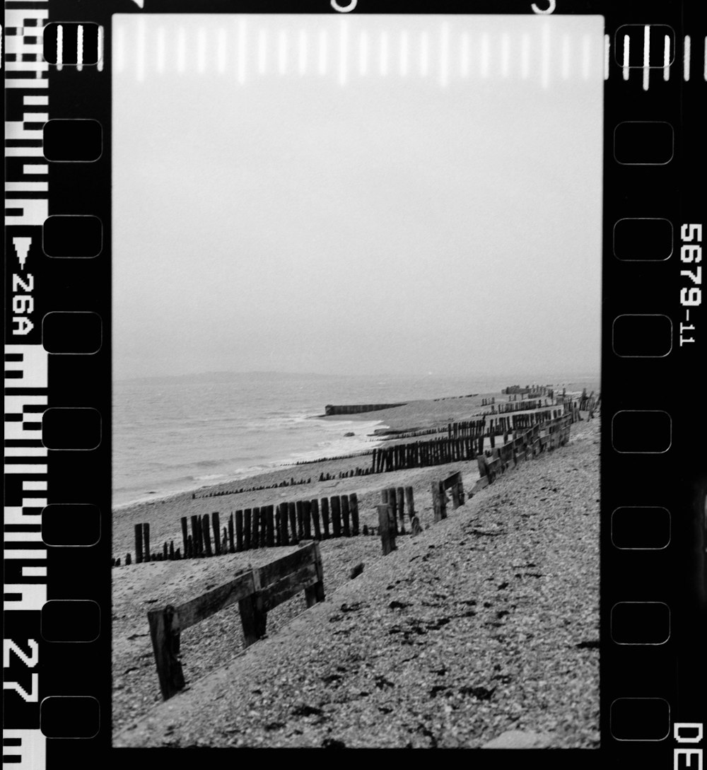 a black and white photo of a beach