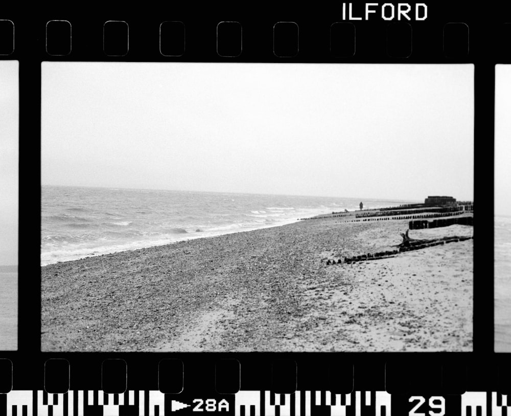 a black and white photo of a beach