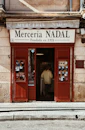 a man standing in the doorway of a store