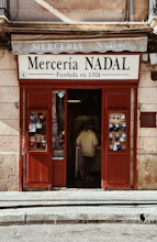 a man standing in the doorway of a store