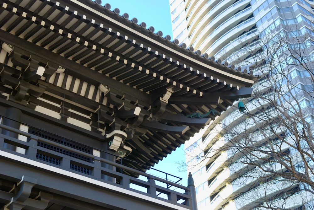 a tall building next to a very tall building