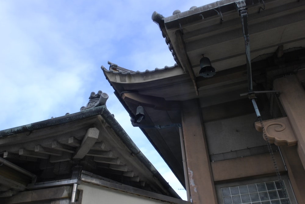 the roof of a building with a sky background