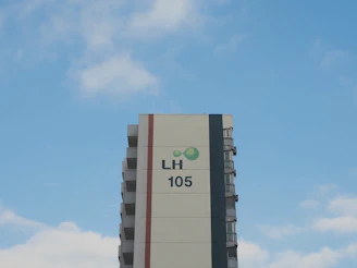 a tall building with a sky background