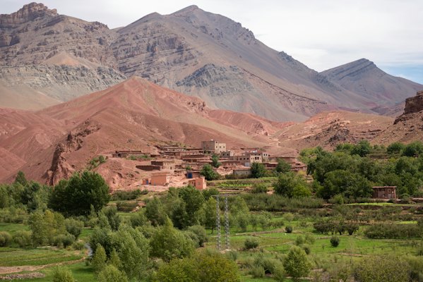 Red hills and green fields in a valley of the Atlas — Ouarzazate, Morocco