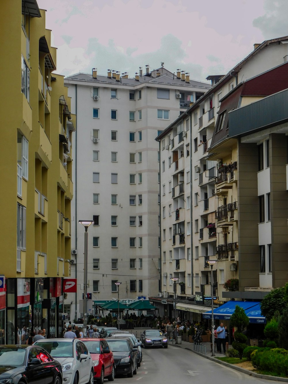 a city street filled with lots of tall buildings