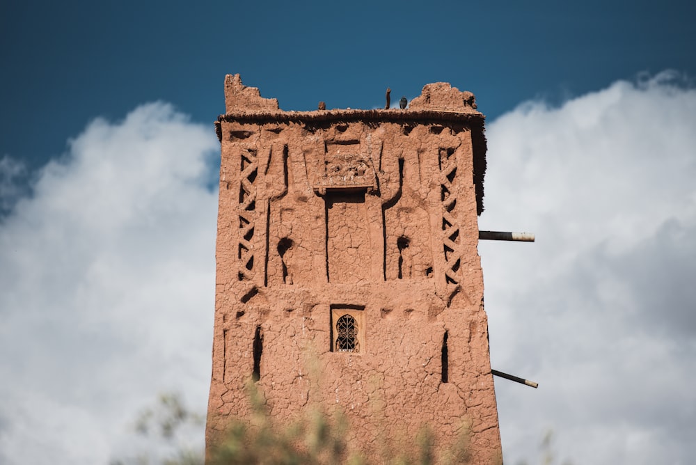 a tall building with a clock on the side of it